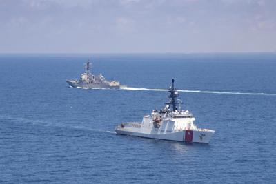 FILE - In this Aug. 27, 2021, file photo provided by U.S. Coast Guard, Legend-class U.S. Coast Guard National Security Cutter Munro (WMSL 755) transits the Taiwan Strait during a routine transit with Arleigh Burke class guided-missile destroyer USS Kidd (DDG 100).  North Korea on Saturday, Oct. 23, accused the Biden administration of raising military tensions with China with its “reckless” backing of Taiwan and claimed that the growing U.S. military presence in the region poses a potential threat to the North.(U.S. Coast Guard via AP, File)